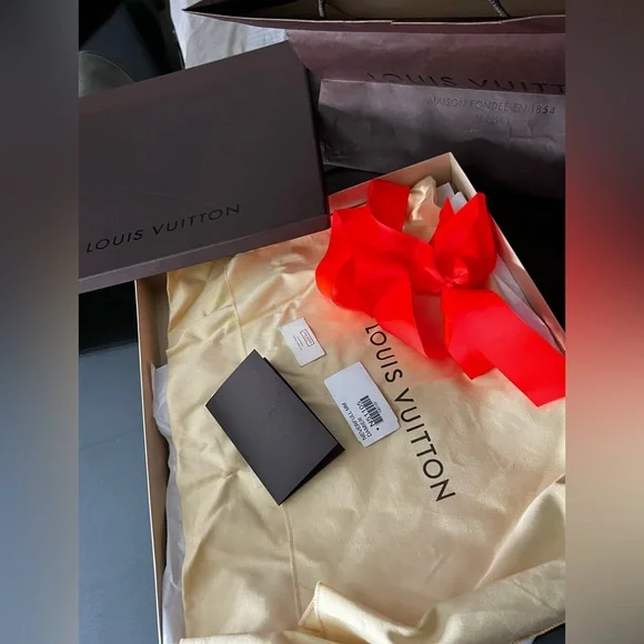 Louis Vuitton Dark Brown Box with Vibrant Red Ribbon